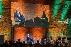 Ben List being interviewed on stage.