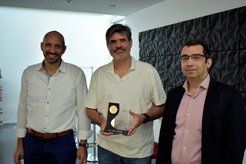 Prof. Frank Neese, Director at the MPI (center) welcomes the decision of the European Chemical Society to name an award after Walter Thiel. Dimitrios Manganas (right) and Dimitrios Liakos (left) represent the Institute's Department of Molecular Theory and Spectroscopy at the conference in Thessaloniki.